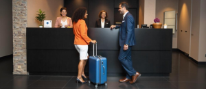 freepik__three-people-of-average-age-35-at-a-hotel-receptio__50438