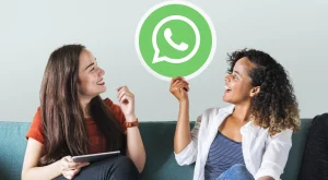 young-women-showing-whatsapp-messenger-icon